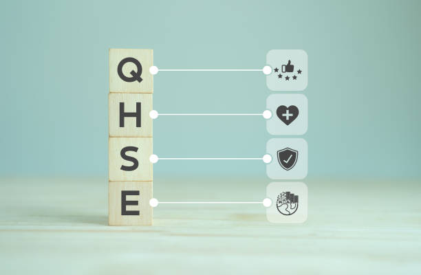 QHSE-Quality Health Safety Environment. Safety and health at workplace concept. Maximize value by successfully implementing QHSE management system. QHSE text and symbols on wooden cube blocks.